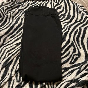 Size 0 flare leg black dress pants. Some wear on the pants shown in pictures.